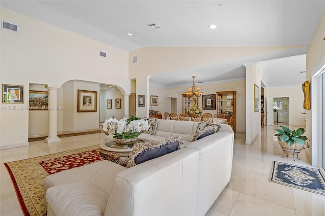 living room with an inviting chandelier, arched walkways, decorative columns, and visible vents