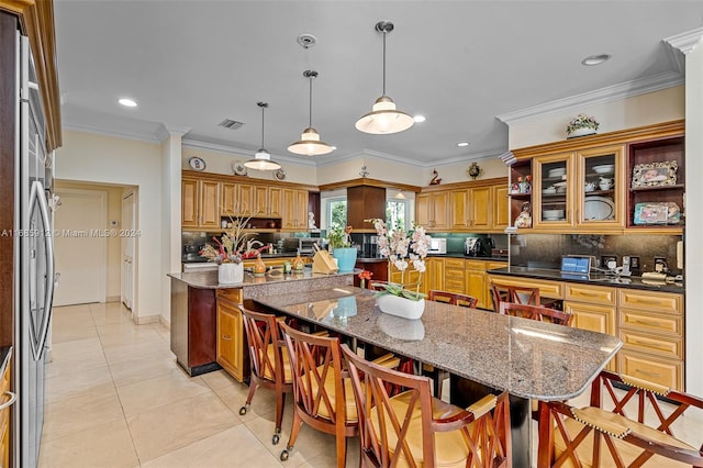 kitchen featuring a breakfast bar, recessed lighting, light tile patterned floors, tasteful backsplash, and a kitchen island