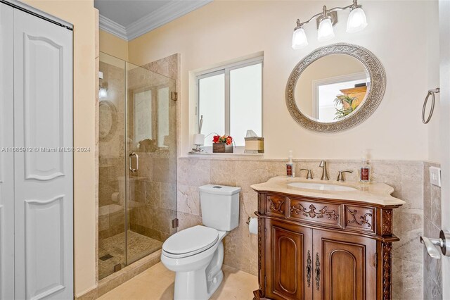 bathroom featuring crown molding, toilet, tile walls, and a shower stall