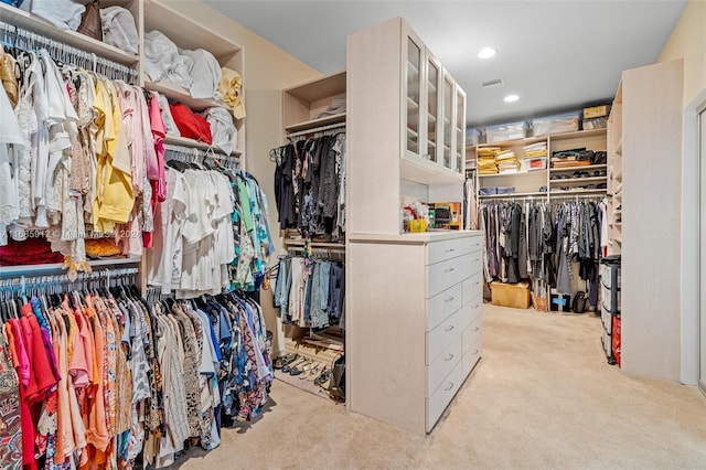 spacious closet with carpet floors and visible vents