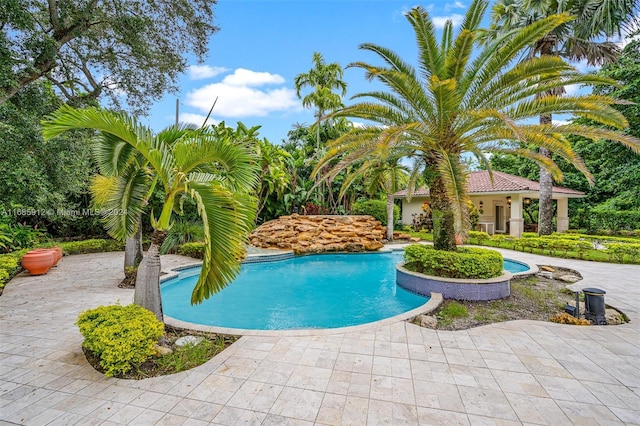 pool featuring a patio area