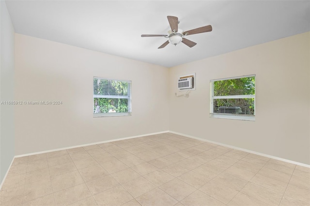 unfurnished room with baseboards, a ceiling fan, and a wall unit AC