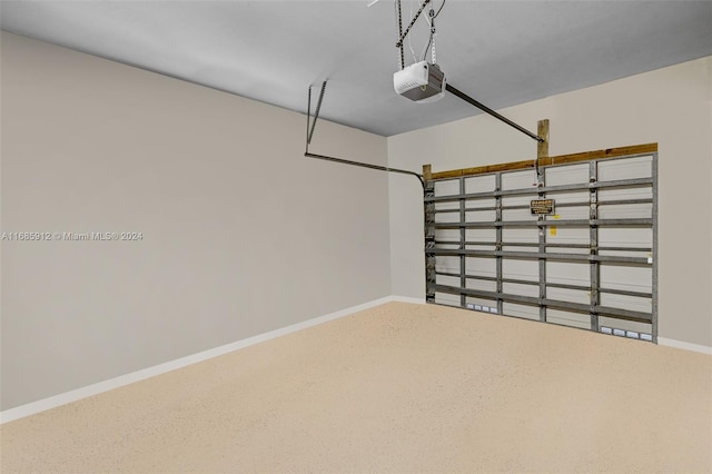 garage with baseboards and a garage door opener
