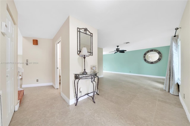 hall with light tile patterned flooring