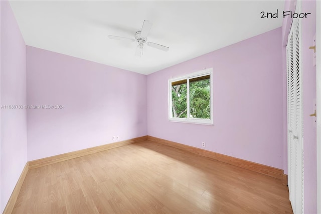 interior space with hardwood / wood-style floors, a closet, and ceiling fan