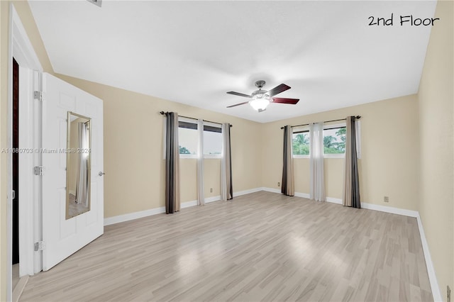 unfurnished bedroom featuring light wood-type flooring and ceiling fan