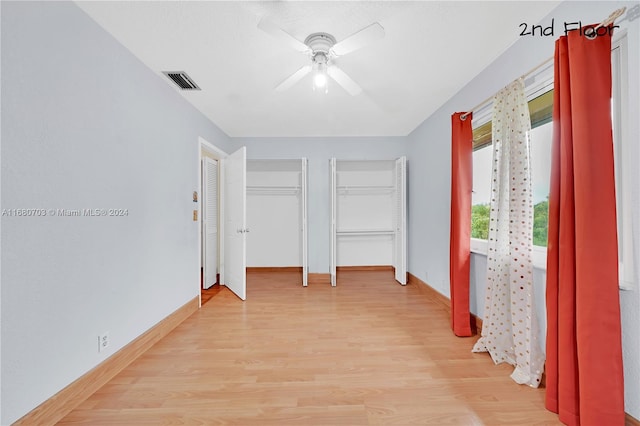 hallway with light hardwood / wood-style flooring