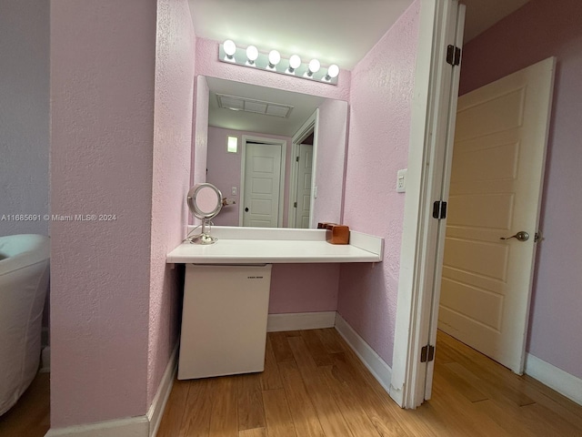 bathroom featuring vanity and hardwood / wood-style floors