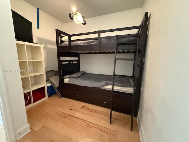 bedroom with wood-type flooring