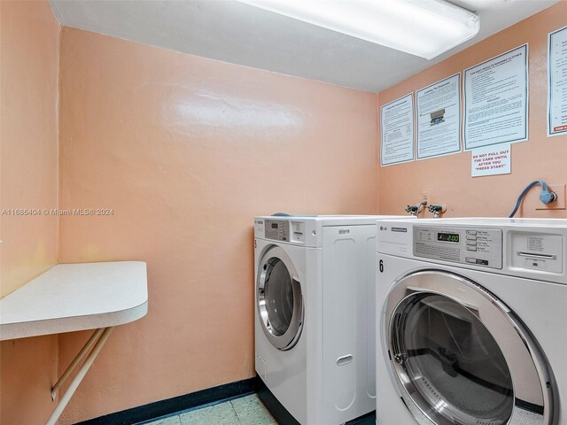 clothes washing area featuring washer and dryer