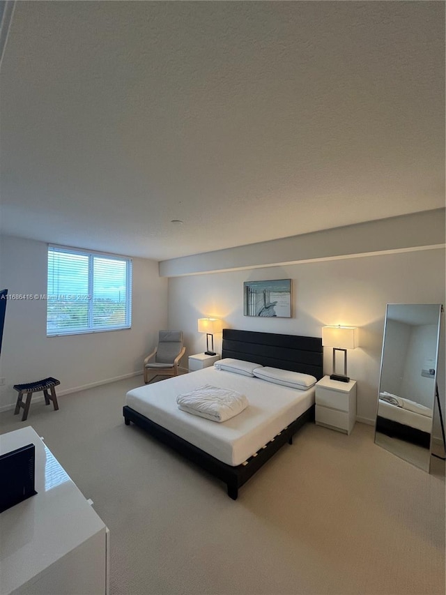 bedroom with carpet flooring and baseboards