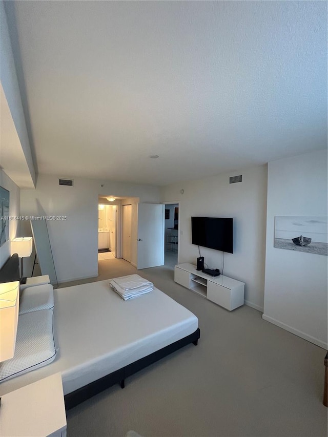 bedroom featuring baseboards, visible vents, and carpet flooring