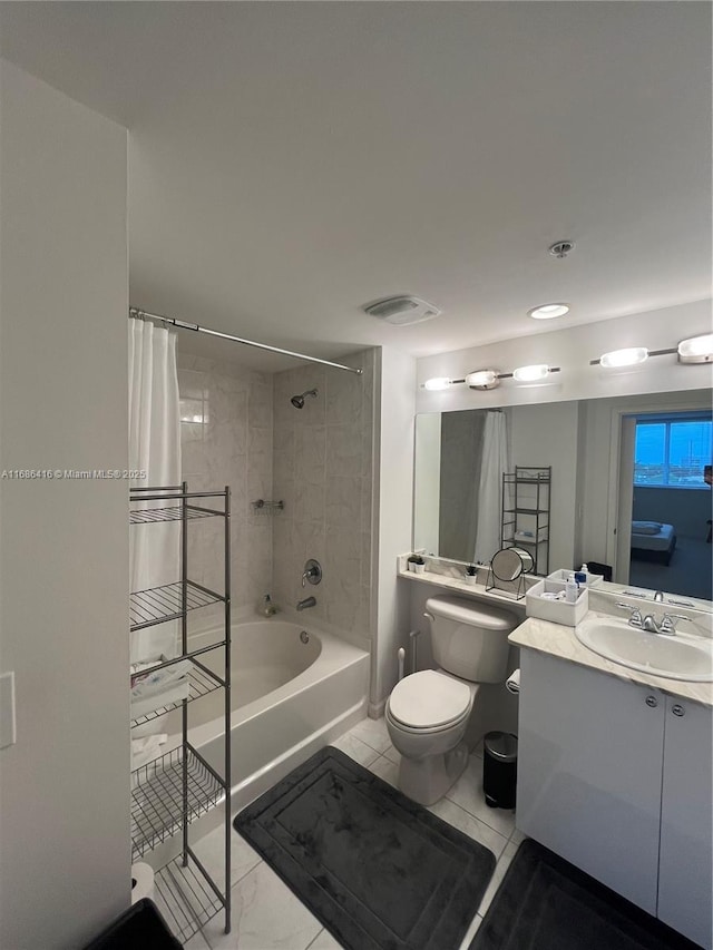 bathroom featuring visible vents, shower / tub combo with curtain, vanity, and toilet