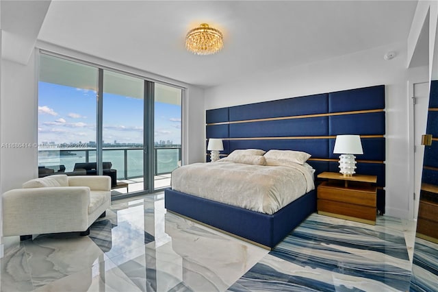 bedroom featuring access to exterior, floor to ceiling windows, a water view, and multiple windows