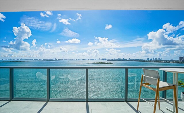 balcony featuring a water view