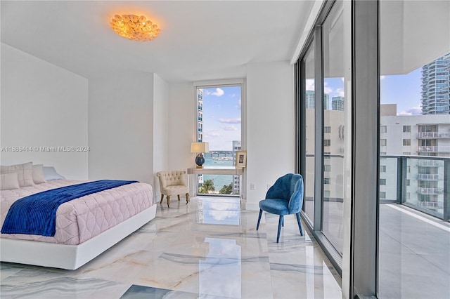 bedroom featuring a wall of windows