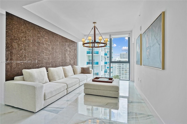 living room featuring a wall of windows and a notable chandelier