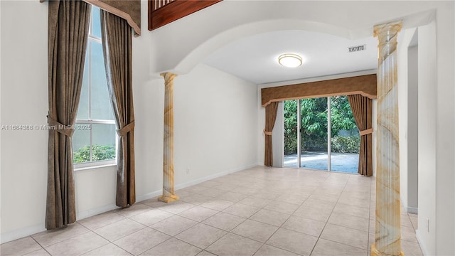 4795 S Classical Blvd, Delray Beach, FL 33445 - tiled spare room with visible vents, baseboards, ornate columns, and arched walkways