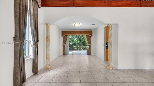 4795 S Classical Blvd, Delray Beach, FL 33445 - corridor with light tile patterned flooring, arched walkways, baseboards, and visible vents