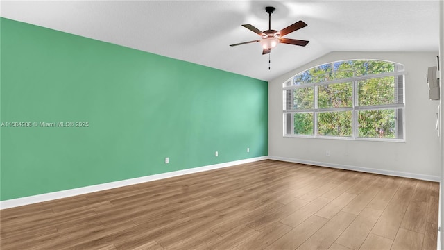4795 S Classical Blvd, Delray Beach, FL 33445 - unfurnished room featuring light wood-type flooring, baseboards, ceiling fan, and vaulted ceiling