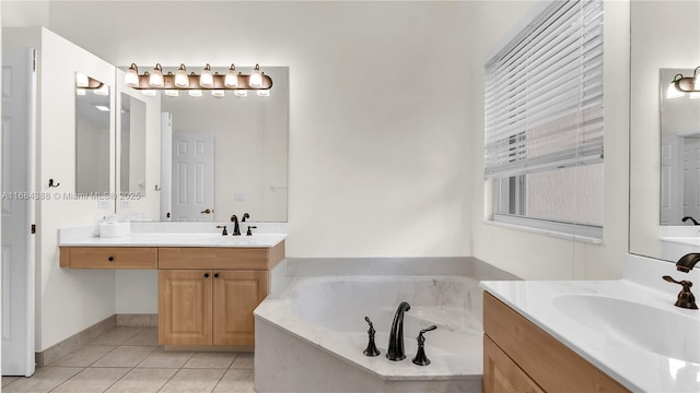 4795 S Classical Blvd, Delray Beach, FL 33445 - bathroom featuring two vanities, tile patterned floors, a sink, and a garden tub