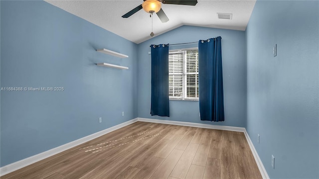 4795 S Classical Blvd, Delray Beach, FL 33445 - spare room with lofted ceiling, wood finished floors, visible vents, ceiling fan, and baseboards