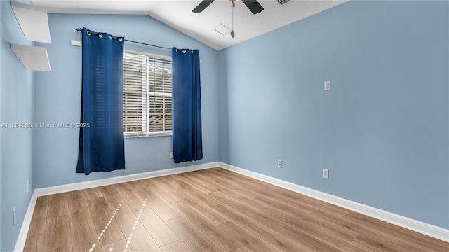 4795 S Classical Blvd, Delray Beach, FL 33445 - empty room with lofted ceiling, baseboards, a ceiling fan, and wood finished floors