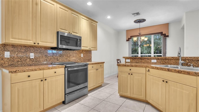 4795 S Classical Blvd, Delray Beach, FL 33445 - kitchen featuring an inviting chandelier, light tile patterned floors, a sink, stainless steel appliances, and light brown cabinets
