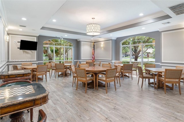 4795 S Classical Blvd, Delray Beach, FL 33445 - dining space featuring a tray ceiling, crown molding, a decorative wall, and visible vents
