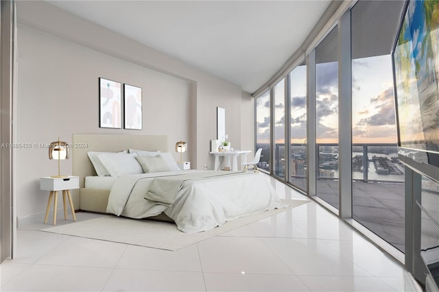 bedroom featuring access to outside and light tile patterned floors