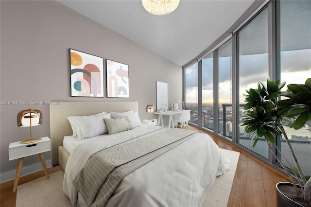 bedroom with light hardwood / wood-style flooring and access to exterior