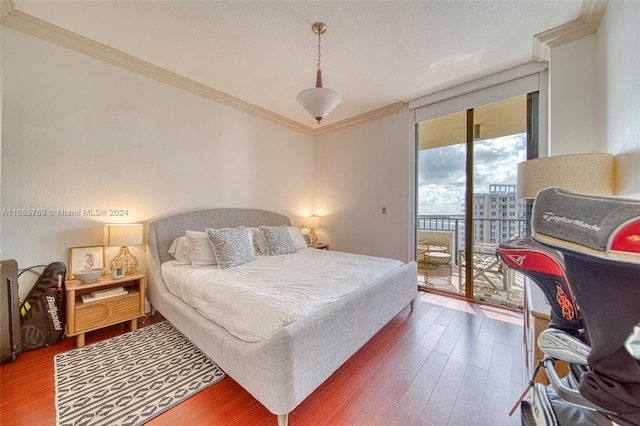 bedroom with access to outside, a wall of windows, wood-type flooring, and crown molding