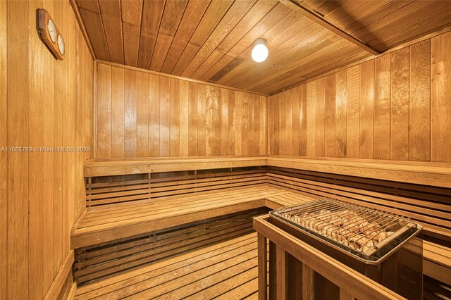 view of sauna / steam room with wood walls and wooden ceiling