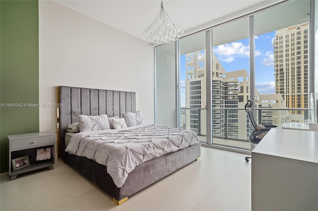 bedroom with expansive windows and a chandelier