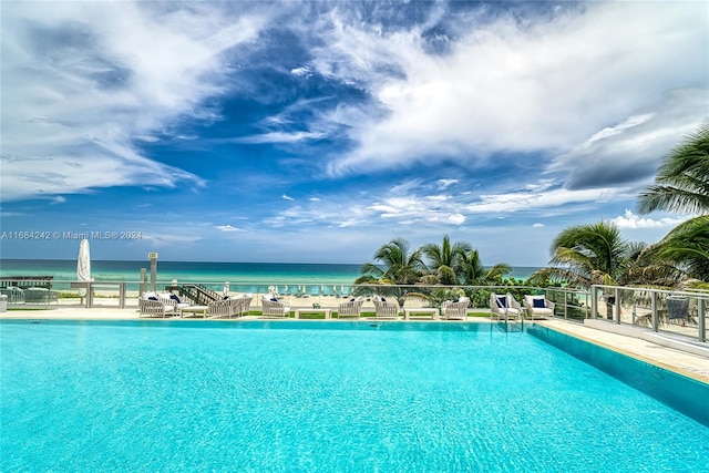 view of pool with a water view