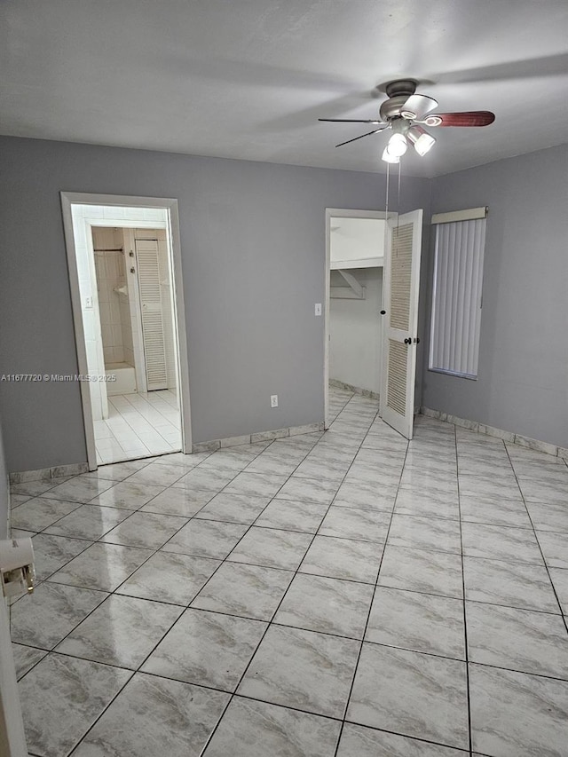 unfurnished room featuring ceiling fan