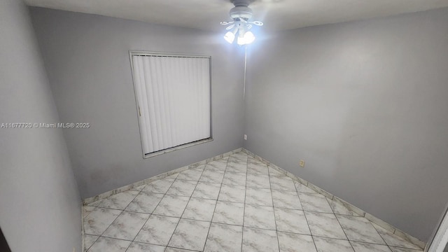 spare room with ceiling fan