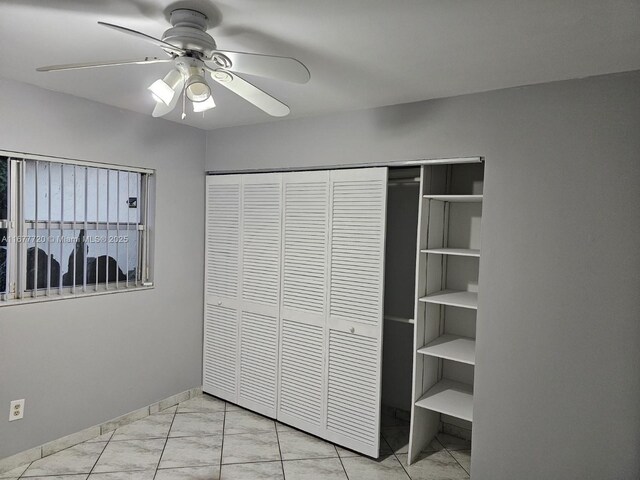 unfurnished bedroom with a closet and ceiling fan