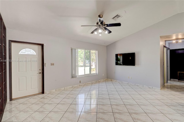 empty room with light tile patterned floors, visible vents, a ceiling fan, and a sink