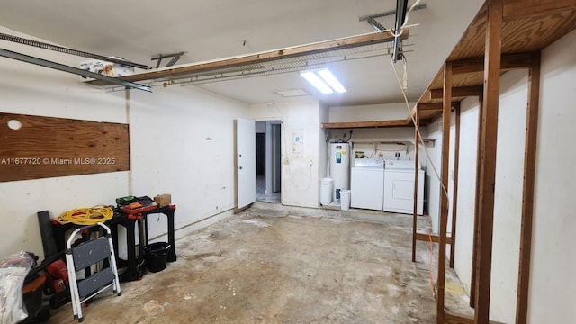 garage with water heater and separate washer and dryer