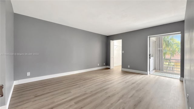 spare room with light hardwood / wood-style floors