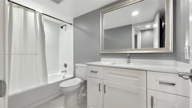 full bathroom featuring vanity, toilet, tile patterned floors, and shower / bath combo with shower curtain