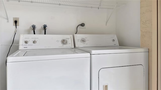 laundry area with washing machine and dryer