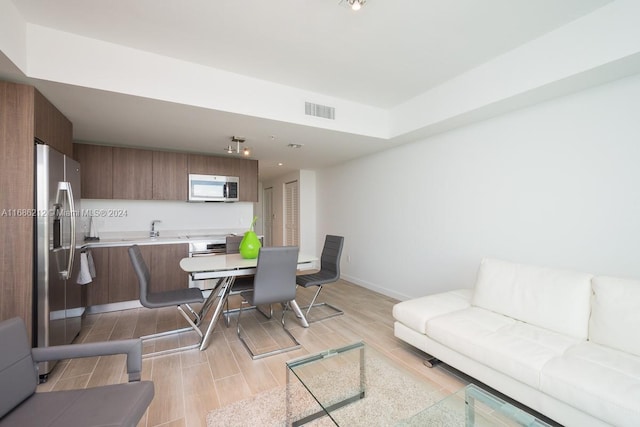 living room with light hardwood / wood-style floors