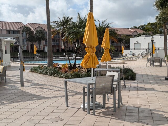 view of patio featuring a community pool