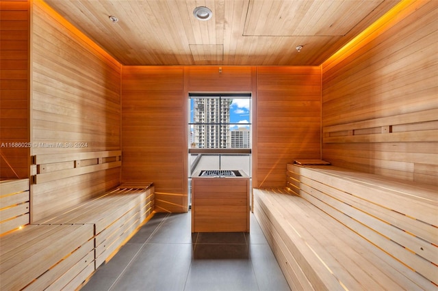 view of sauna with wood ceiling and wood walls