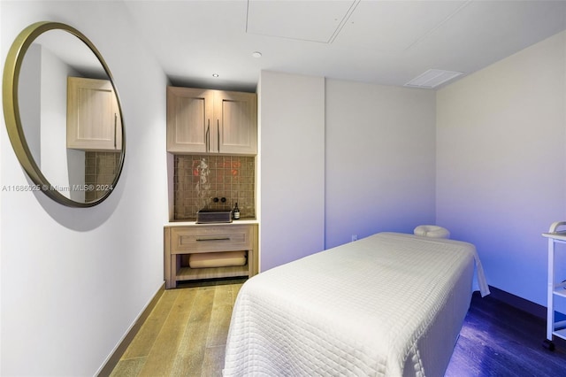 bedroom featuring hardwood / wood-style flooring