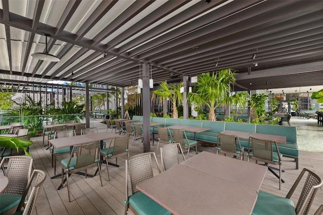 wooden deck featuring ceiling fan