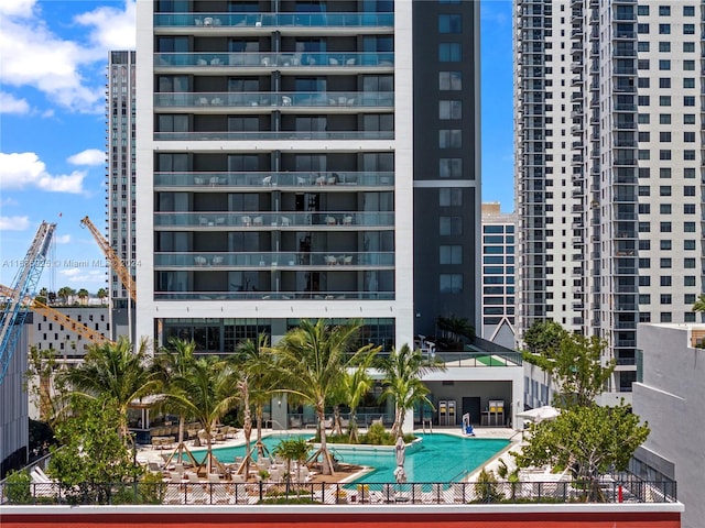 view of property featuring a community pool