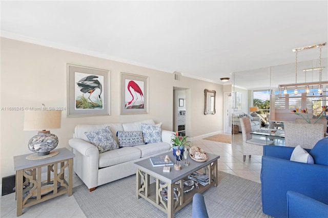 living room with crown molding and light tile patterned floors